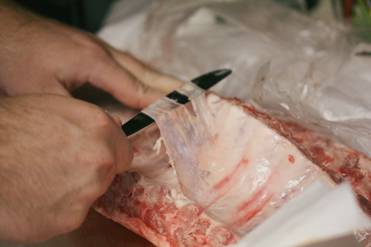 Use a butter knife to remove the membrane